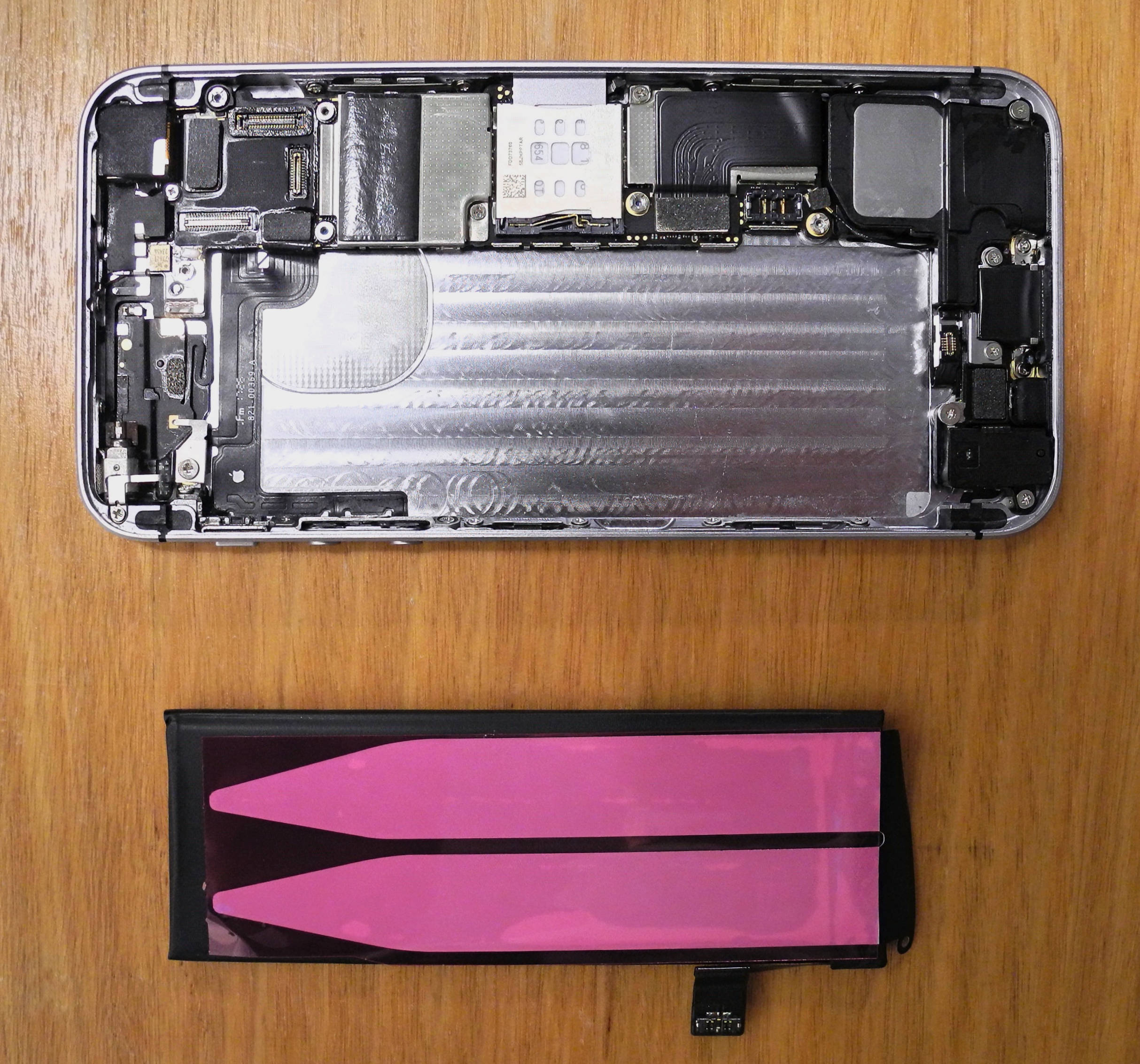 Photo of phone interior after removal of battery and remnants of adhesive strips.